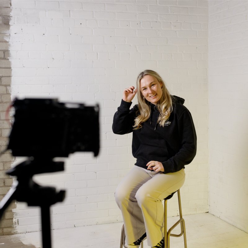 Martha Dale sat on a stool, being recorded.